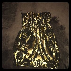 Im selling a gold/black strapless dress.
